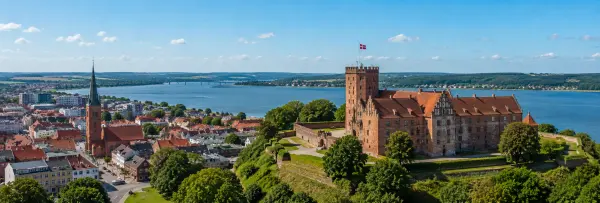 Aerial panoramic view of Kolding, Denmark, with Koldinghus Castle and Kolding Fjord