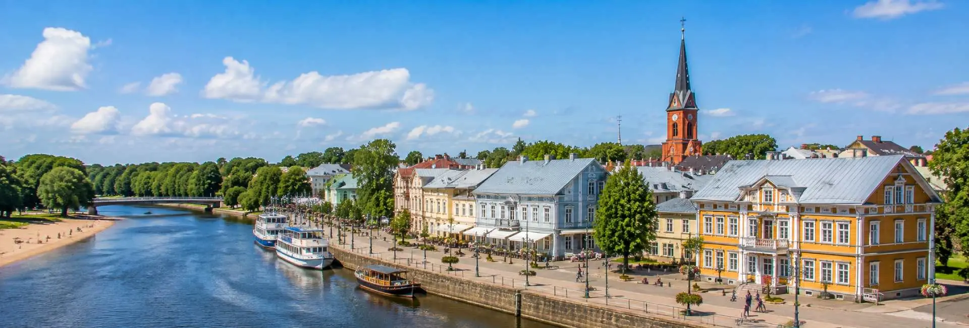 Pärnu riverside with historic buildings and St. Elizabeth’s Church in Estonia