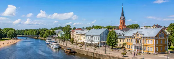 Pärnu riverside with historic buildings and St. Elizabeth’s Church in Estonia