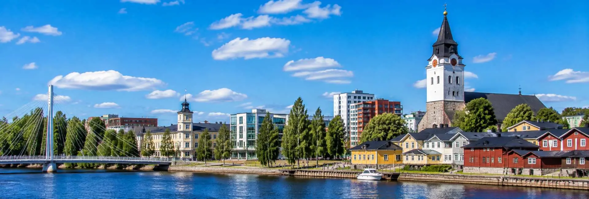 Oulu, Finland, with the Oulujoki waterfront, historic buildings, and Oulu Cathedral tower