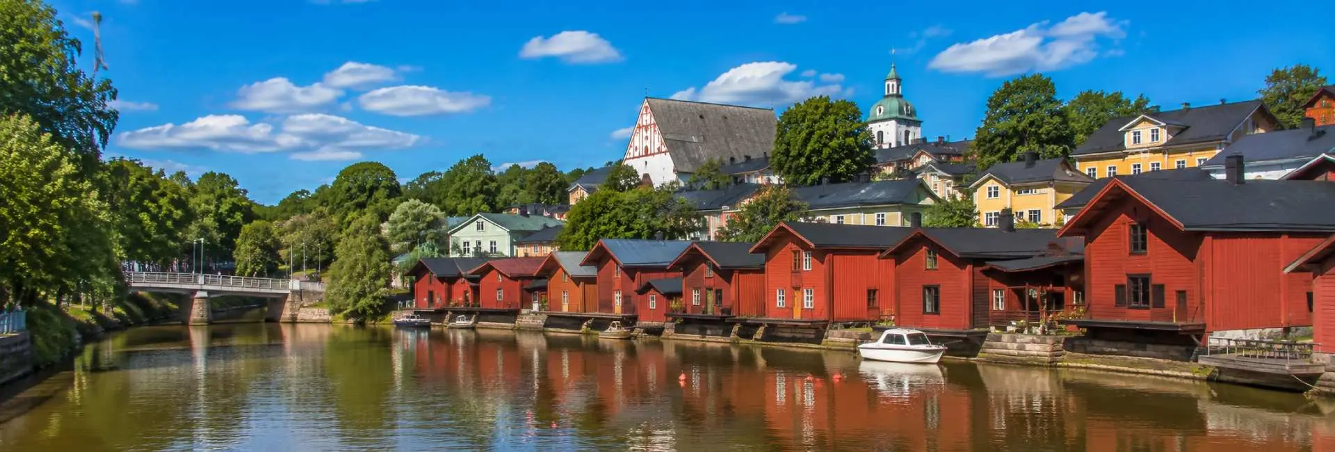 Porvoo, Finland, with red wooden riverside houses, colorful buildings, and historic Porvoo Cathedral