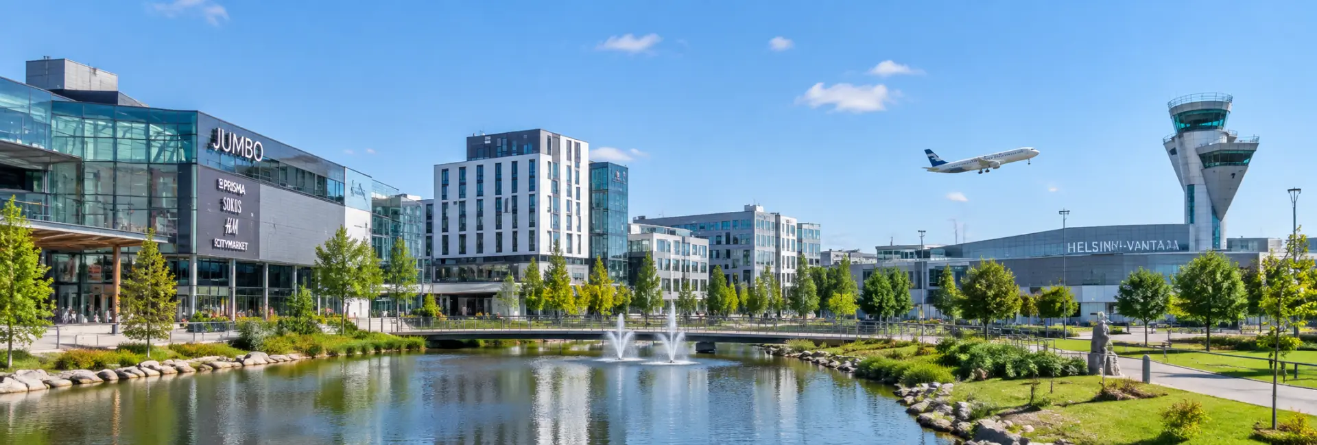 Panoramic daytime view of Vantaa, Finland, featuring modern city buildings and Helsinki-Vantaa Airport.