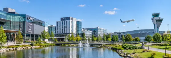Panoramic daytime view of Vantaa, Finland, featuring modern city buildings and Helsinki-Vantaa Airport.