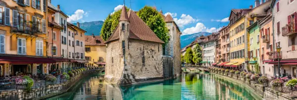 Annecy, France panoramic view of historic canals, colorful buildings and the French Alps