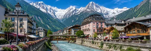 Chamonix, France with alpine buildings, river and snow-capped Mont Blanc mountains