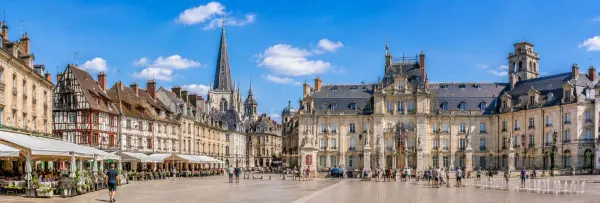Dijon, France historic square with medieval houses and grand Palace of the Dukes