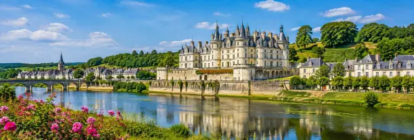 Loire Valley, France, with a grand château, river, stone bridge and lush countryside
