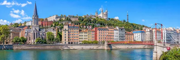 Lyon, France panoramic cityscape with historic buildings, river and Basilica of Fourvière