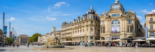 Place de la Comédie in Montpellier, France, with historic architecture, cafés and the Three Graces fountain