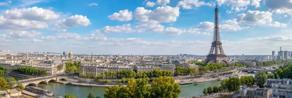 Panoramic daytime view of Paris featuring the Eiffel Tower