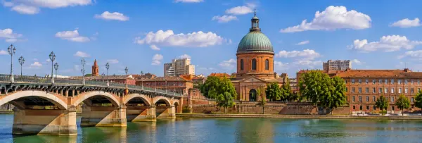 Toulouse, France with the Garonne River, historic Pont Neuf and city skyline
