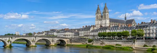 Tours, France, with the Loire River, historic bridge, elegant buildings and Saint-Gatien Cathedral