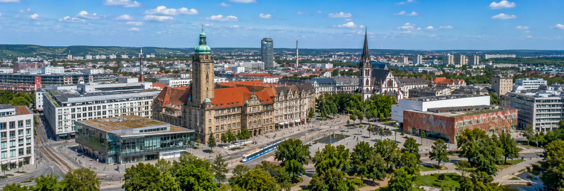 Chemnitz, Germany aerial view of the historic city center, landmarks, tramways, and surrounding skyline