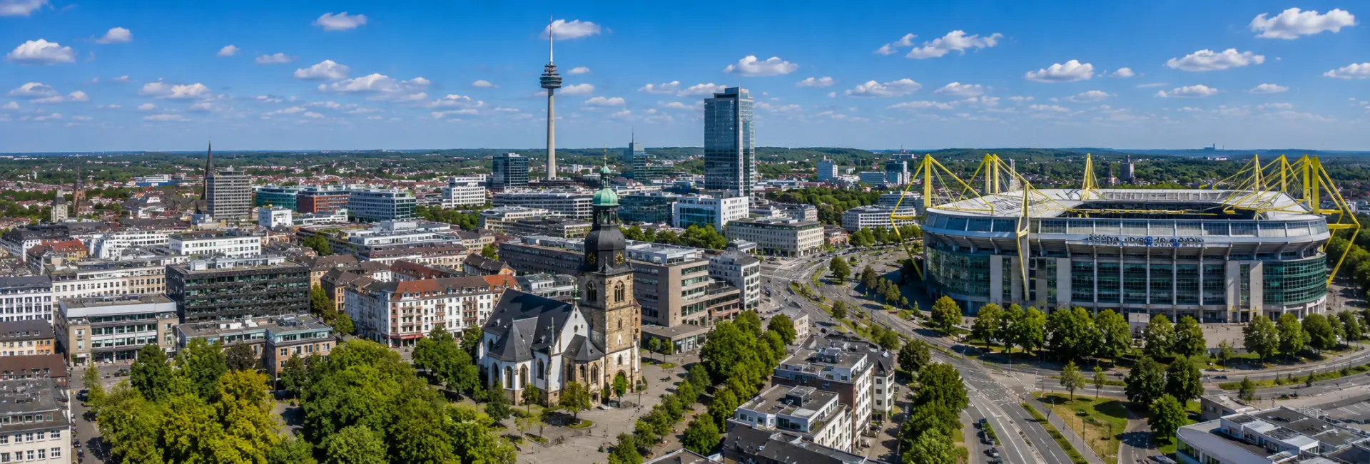 Dortmund, Germany skyline with historic church, city tower, modern buildings, and Signal Iduna Park