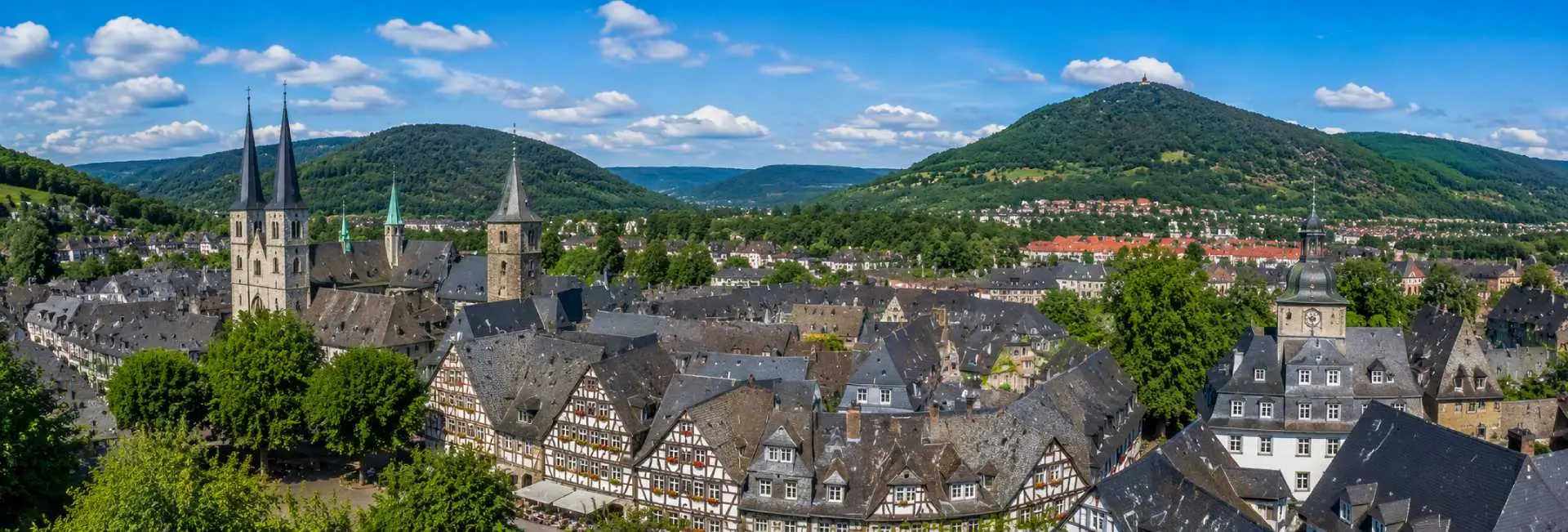 Panoramic view of Goslar, Germany, with historic half-timbered houses, churches and the Harz Mountains