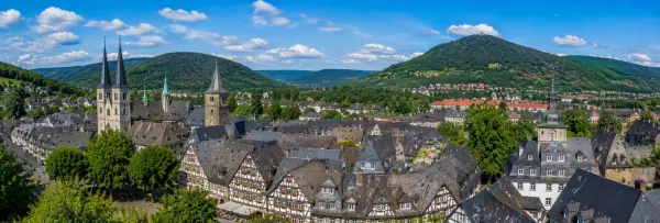 Panoramic view of Goslar, Germany, with historic half-timbered houses, churches and the Harz Mountains