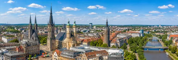 Aerial panoramic view of Halle (Saale), Germany, with historic rooftops, churches and the Saale River