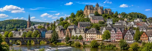 Panoramic view of Marburg, Germany, with half-timbered houses, Marburg Castle, Lahn River and wooded hills