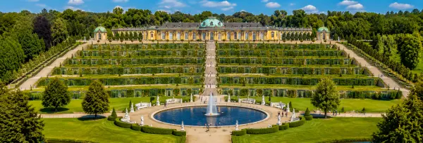 Sanssouci Palace in Potsdam, Germany, with terraced vineyards, formal gardens and fountain