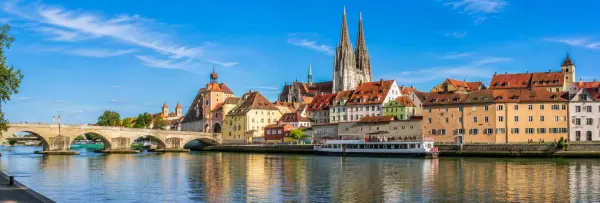 Regensburg, Germany historic old town with Stone Bridge, Danube River and Gothic cathedral
