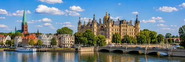 Schwerin, Germany skyline with Schwerin Castle, lake, historic buildings and cathedral