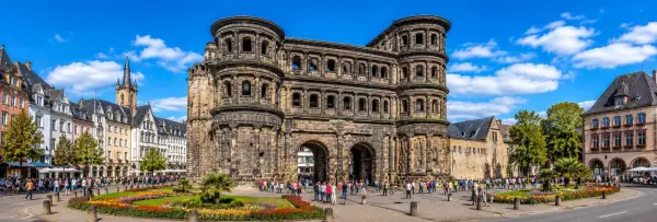 Porta Nigra Roman gate surrounded by historic architecture in Trier, Germany