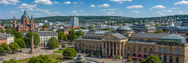 Wiesbaden, Germany skyline with Kurhaus, historic buildings, church and green hills