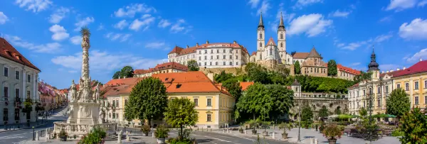 Veszprém, Hungary, with historic buildings, the castle district, cathedral towers, and a landscaped town square.