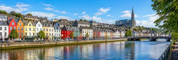 Cork, Ireland panoramic view of colorful riverside buildings and St Fin Barre's Cathedral