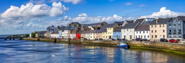Galway, Ireland panoramic view of colorful waterfront buildings along the River Corrib