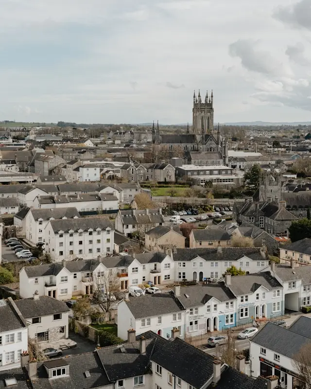 Aerial view of Kilkenny city with historic buildings and a prominent cathedral tower