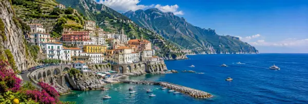 Amalfi Coast, Italy with colorful cliffside villages, mountains, marina and blue Mediterranean Sea