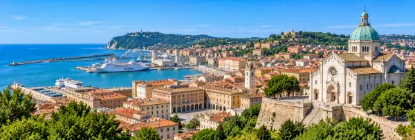 Panoramic view of Ancona, Italy, with San Ciriaco Cathedral, historic port, terracotta rooftops and Adriatic coast.