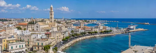 Panoramic view of Bari, Italy, with historic architecture, waterfront promenade, harbor, and Adriatic Sea