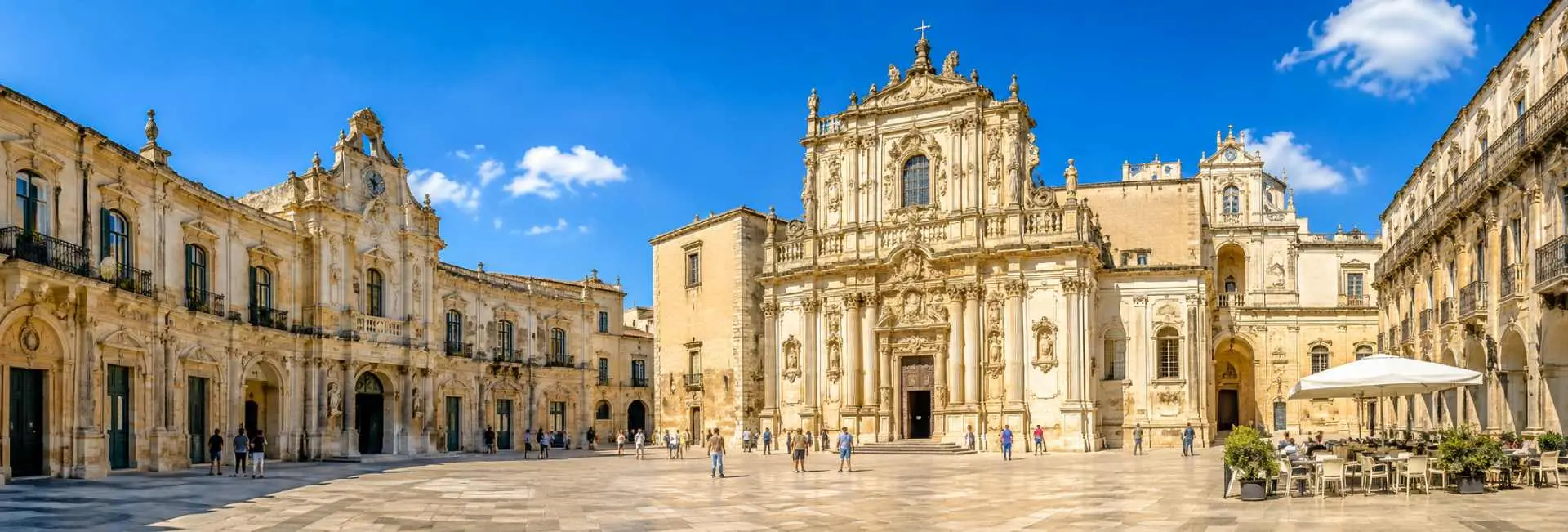 Lecce, Italy historic Baroque square with ornate architecture under a bright blue sky