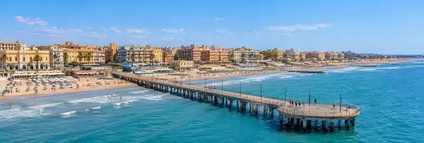 Lido di Ostia waterfront with sandy beaches, seaside promenade and the iconic Ostia pier
