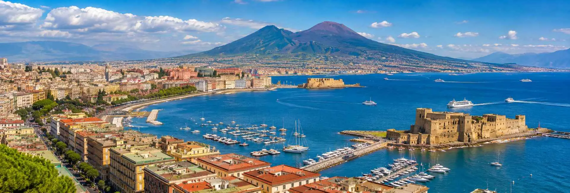 Naples waterfront with Castel dell’Ovo, Bay of Naples and Mount Vesuvius in Italy