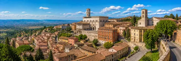 Perugia, Italy with medieval buildings, terracotta rooftops, historic towers and Umbrian countryside