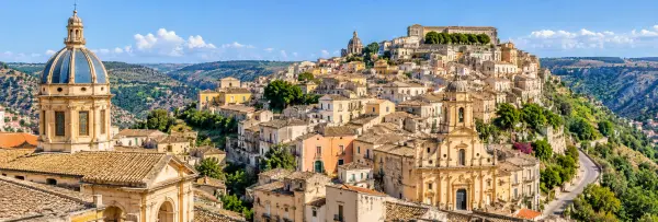Panoramic view of Ragusa Ibla, Sicily, with Baroque architecture, domes, rooftops and surrounding valleys