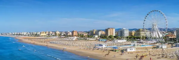 Rimini, Italy panoramic view of its sandy Adriatic beach, waterfront skyline and Ferris wheel