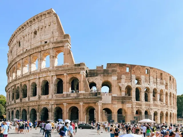 Colosseum in Rome under a clear blue sky