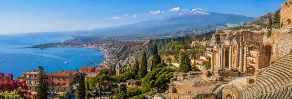 Taormina, Sicily with Mediterranean coast, ancient Greek Theatre and Mount Etna