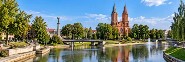 Senvagė in Panevėžys, Lithuania, with the old riverbed, fountain, park and red-brick church