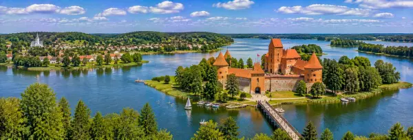 Trakai Island Castle surrounded by Lake Galvė, wooded islands and scenic countryside
