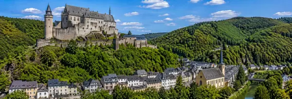 Vianden Castle overlooking the historic town and lush green hills in Luxembourg