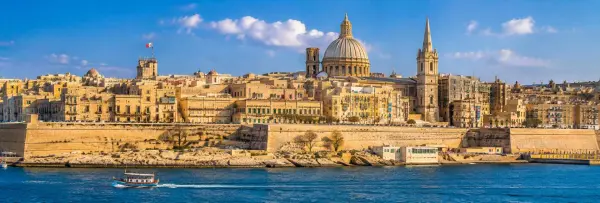 Valletta, Malta skyline with historic limestone buildings, St. John's Co-Cathedral and Grand Harbour