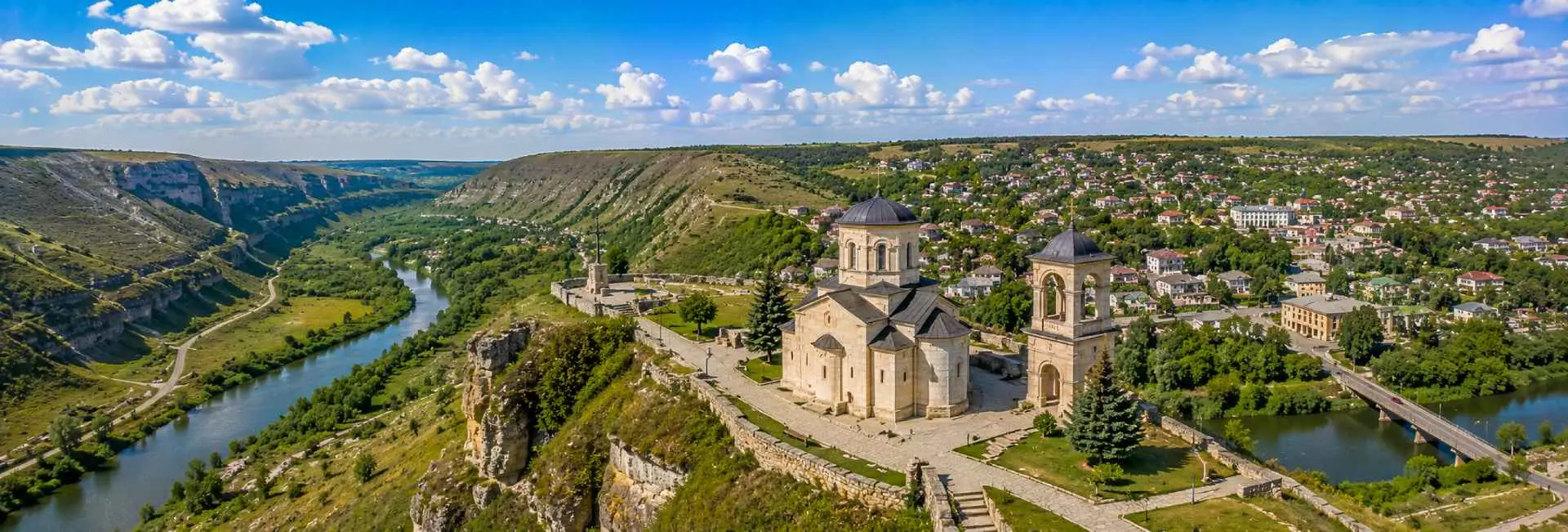 Orhei panoramic view with historic landmarks, green valley, limestone cliffs and surrounding town