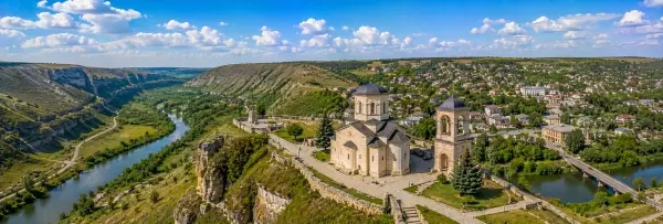 Orhei panoramic view with historic landmarks, green valley, limestone cliffs and surrounding town