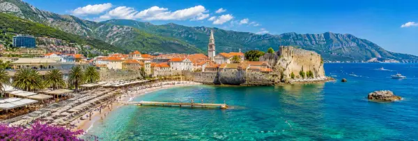 Budva Old Town and medieval Citadel beside the turquoise Adriatic Sea in Montenegro.