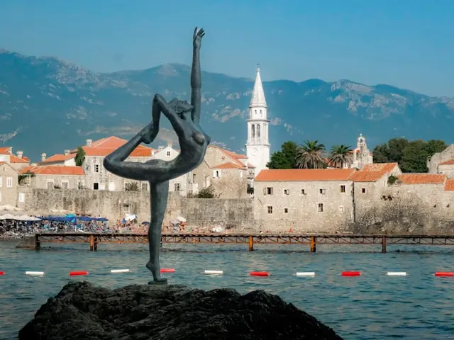 Dancer statue overlooking Budva Old Town and the Adriatic Sea in Montenegro